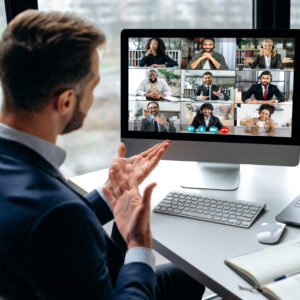 Confident successful businessman, company boss, stock investor, having financial brainstorm with group of multiracial people by video conference, discuss investments in the stock market, risks