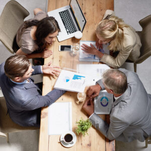 High angle shot of a group of businesspeople having a discussion in an office.